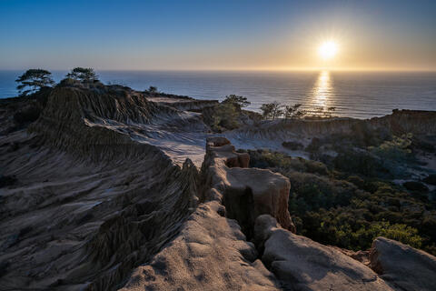 Torrey Pines bluffs overlooking the Pacific Ocean as the sun sets