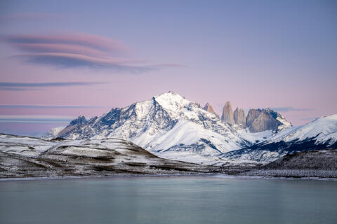 The sun rises in the early am at laguna amarga in Torres del Paine national  park in Chile in the winter.