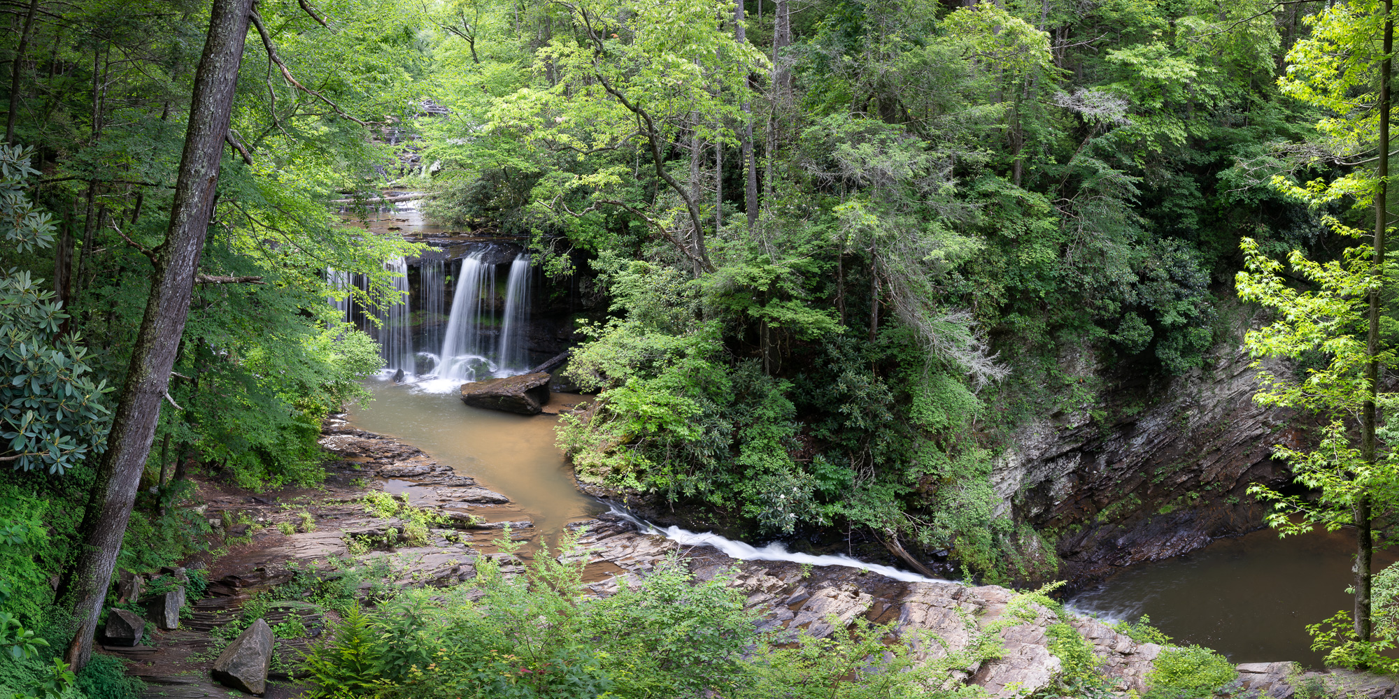 Brasstown Falls brasstown veil and brasstown sluice are seen flowing into the brasstown trout pool during the summer months in south Carolina, usa.